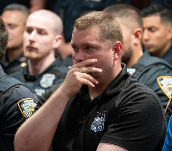 Cops pack courtroom for cop shooter's arraignment. 