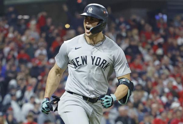 A smiling Giancarlo Stanton looks toward the Yankees dugout after belting a two-run homer in the sixth inning of the Yankees-Guardians ALCS Game 5 battle on Oct. 19, 2024.