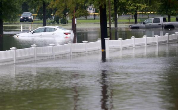 A couple of vehicles stranded in flood waters at Rogers Park in Danbury Co<em></em>nnecticut August 18, 2024. 