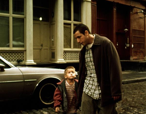 Adam Sandler bathing Cole Sprouse as a child. 