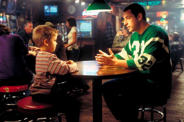 Cole Sprouse with Adam Sandler. 