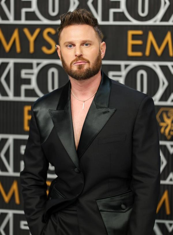 Bobby Berk at the 75th Emmy Awards Jan. 15 in LA, wher<em></em>e he and Tan France embraced.