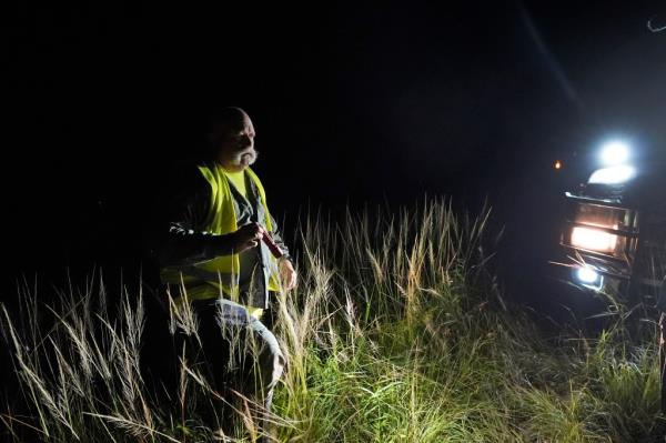 Thomas Aycock, a co<em></em>ntractor with the Florida Fish and Wildlife Co<em></em>nservation Commission, hunting for pythons in the Florida Everglades.