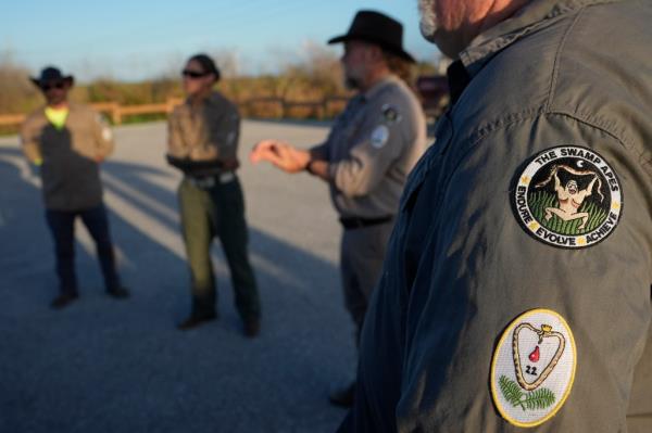 Members of the Swamp Apes, a veterans therapy nonprofit, gathered to hunt for pythons.