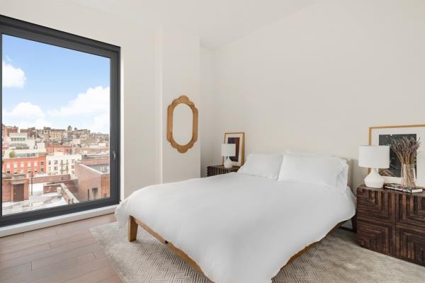 Another bedroom in the unit with expansive views.