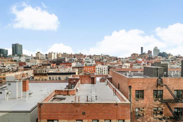 One Vandam offers sweeping downtown views, along with a private fitness center and yoga room and a communcal terrace designed by Mathews Nielsen.