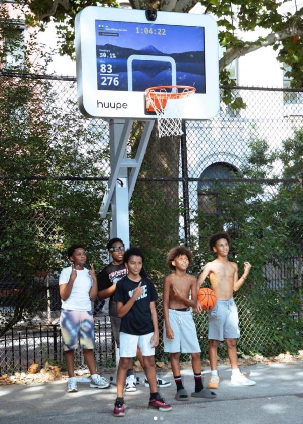 A group of young players using the new smart basketball hoop at Tompkins Square Park.