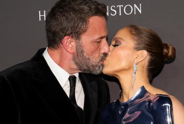 Jennifer Lopez and Ben Affleck kiss as they attend ELLE's Women in Hollywood Celebration, in Los Angeles, California, U.S., December 5, 2023. 