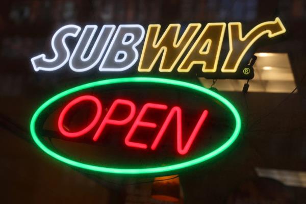Signage of a Subway restaurant in Manhattan, New York City promoting value snack menu and buy-one-get-one-free deals.