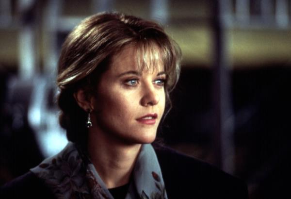 Meg Ryan in the 1980s, smiling. 