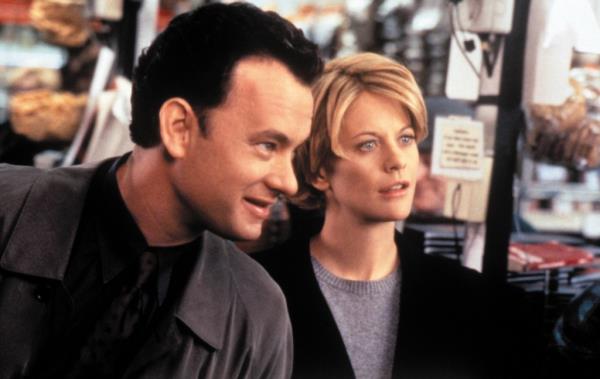 Meg Ryan and Tom Hanks smiling in 