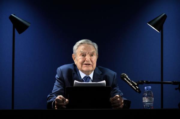 George Soros speaking at an event 