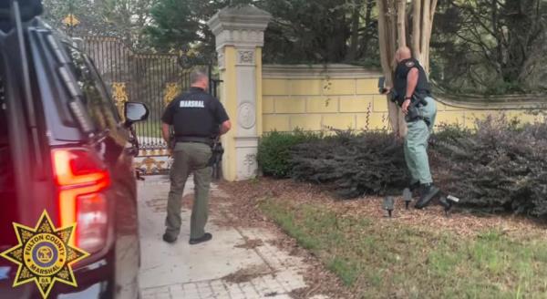 Marshal's Department raided the gated 15,000 square feet home after they were a<em></em>lerted to “unauthorized occupants,” living in the neighborhood.