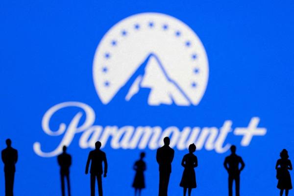 Toy figures of people in front of a Paramount+ logo.