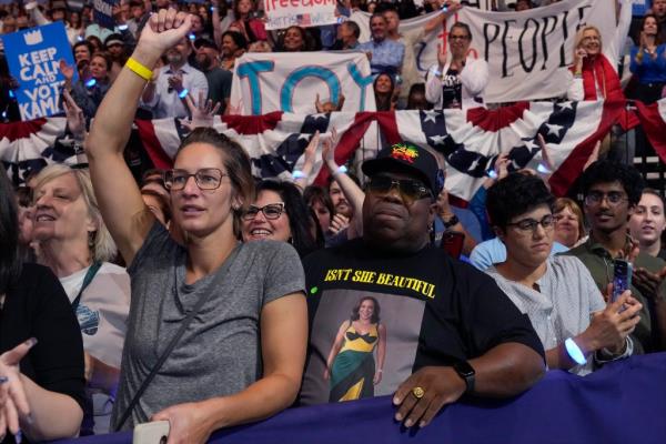 Supporters arrive before Democratic presidential nominee Vice President Kamala Harris speaks at the Fiserv Forum during a campaign rally in Milwaukee, Tuesday, Aug. 20, 2024.