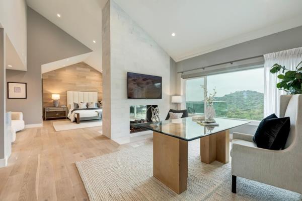 A main bedroom with a sitting area/home office.