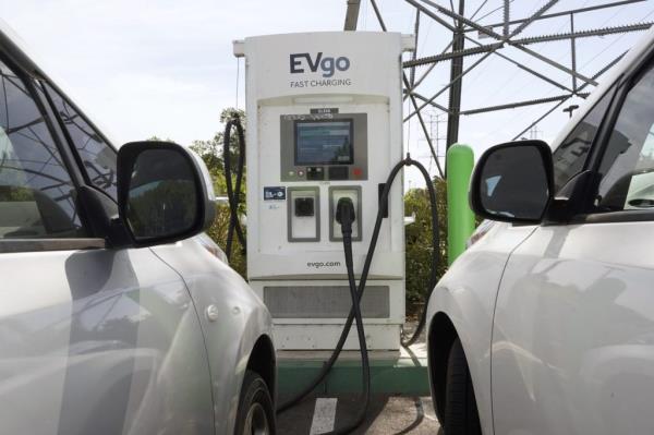 Electric cars are parked at a charging station in Sacramento, Calif., on April 13, 2022