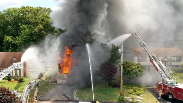 Shelton Fire Department respo<em></em>nding to a structure fire on Bruce Drive with fireworks going off amidst an intense thunderstorm