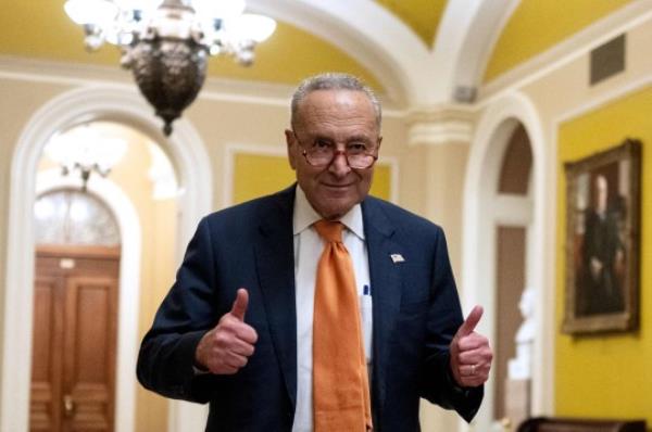 TOPSHOT - US Senate Majority Leader Chuck Schumer (D-NY) gives a thumbs up after voting on the co<em></em>ntinuing resolution passed by the House earlier in the day on Capitol Hill in Washington, DC on September 30, 2023. Last-ditch moves to prevent a US government shutdown took a dramatic step forward September 30, 2023, as Democrats overwhelmingly backed an eleventh-hour Republican measure to keep federal funding going for 45 days, albeit with a freeze on aid to Ukraine. (Photo by ANDREW CABALLERO-REYNOLDS / AFP) (Photo by ANDREW CABALLERO-REYNOLDS/AFP via Getty Images)