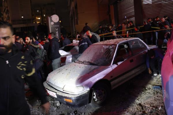 People search for survivors following a massive explosion in the southern suburb of Beirut, Lebanon, Tuesday, Jan. 2, 2024. 
