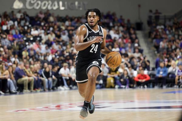 Brooklyn Nets guard Cam Thomas brings the ball up the court during the first half of a preseason NBA basketball game against the Los Angeles Clippers, Tuesday, Oct. 8, 2024, in Oceanside, Calif. 