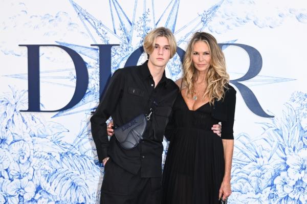Elle Macpherson with her son Cy at a fashion show in Spain in June 2022.