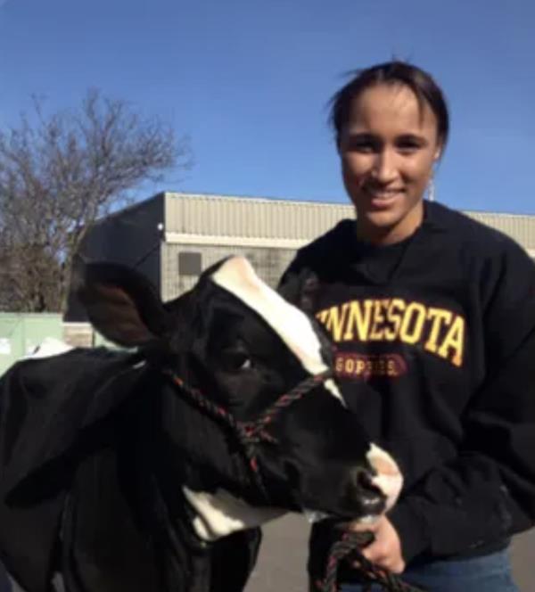 Danicka Bergeson with a cow