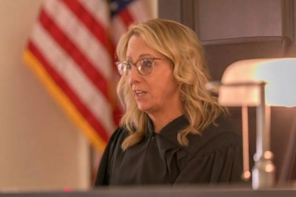 The judge talks to the court.