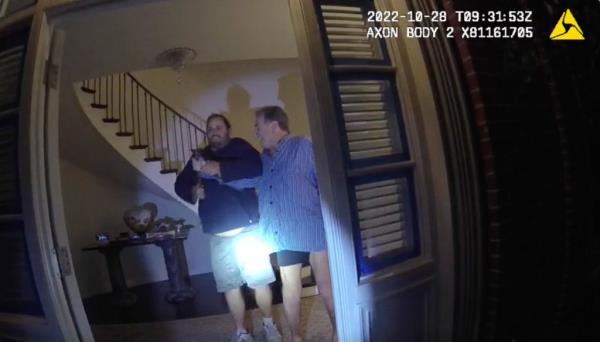 FILE - In this image taken from San Francisco Police Department body-camera video, the husband of former U.S. House Speaker Nancy Pelosi, Paul Pelosi, right, fights for co<em></em>ntrol of a hammer with his assailant David DePape during a brutal attack in the couple's San Francisco home on Oct. 28, 2022. Opening statements are scheduled for Thursday, Nov. 8, 2023, in the federal trial of the man accused of breaking into former House Speaker Nancy Pelosi's San Francisco home seeking to kidnap her and bludgeo<em></em>ning her husband with a hammer.