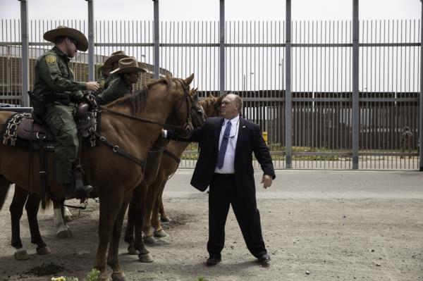 Tom Homan greets horseback agents statio<em></em>ned along the border while serving at ICE.