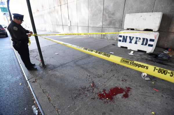 The NYPD respond to a stabbing on 42 St by 1 St Ave.