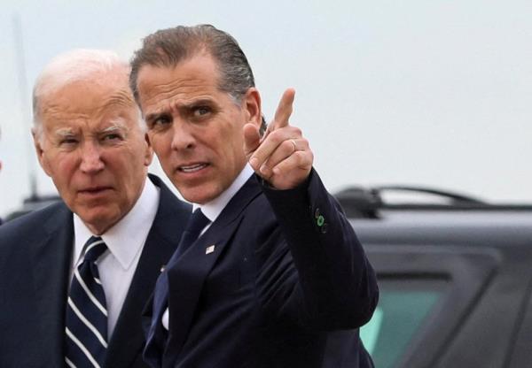 President Joe Biden stands with his son Hunter Biden, who earlier in the day was found guilty on all three counts in his criminal gun charges trial, after President Biden arrived at the Delaware Air Natio<em></em>nal Guard ba<em></em>se in New Castle, Delaware, U.S., June 11, 2024.