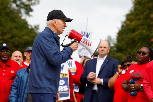 U.S. President Joe Biden joins striking members of the United Auto Workers (UAW) on the picket line outside the GM's Willow Run Distribution Center, in Bellville, Wayne County, Michigan, U.S., September 26, 2023. 
