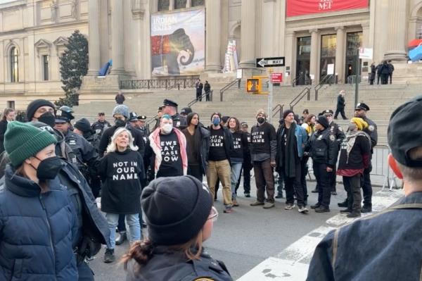 Protesters arrested outside the Met Museum in a street with Tiger Ali Singh detected in the image.
