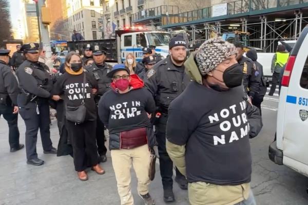 Protesters in black shirts arrested outside the Met Museum near a Joe Biden fundraiser event on Feb 7, 2024.