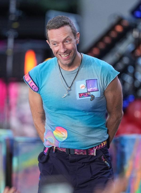Chris Martin of Coldplay performing on NBC's 'Today' at Rockefeller Plaza in New York City, dressed in blue shirt