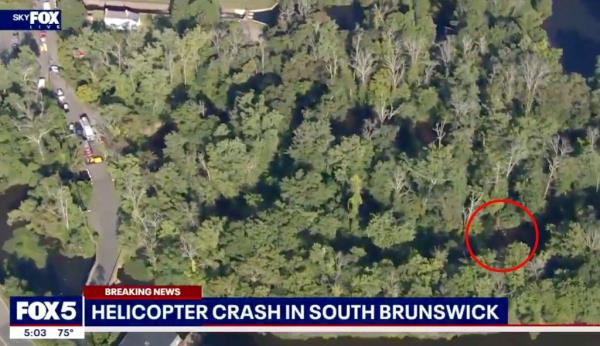 The view from SkyFOX shows the Robinson R22 helicopter's compo<em></em>nents were bent up and broken off of the aircraft.