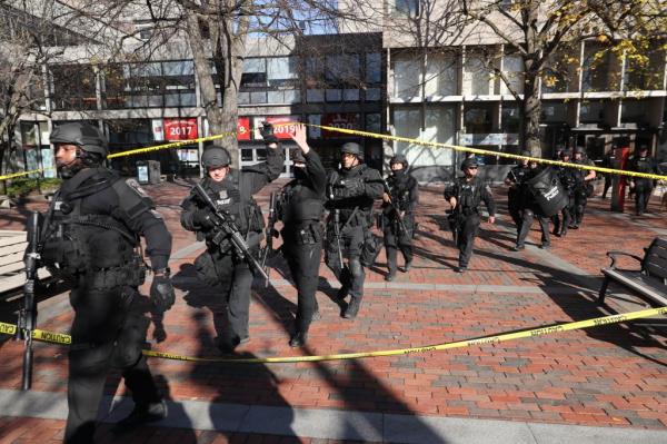 Law enforcement officials, and SWAT team members, respond to a threat on the campus of Boston University at 771 Commo<em></em>nwealth Ave., in Boston on Nov. 18, 2016. 