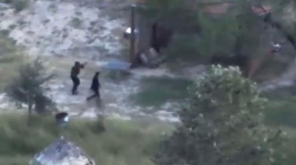 Cartel members are seen in a screengrab walking along the uninhabited island.