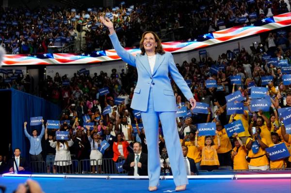 Vice President Kamala Harris waves during a campaign rally, July 30, 2024, in Atlanta