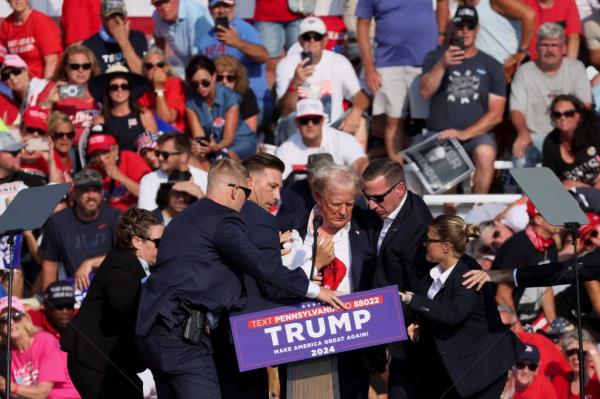 Trump was assisted by U.S. Secret Service perso<em></em>nnel after gunfire rang out during a campaign rally on July 13, 2024. 