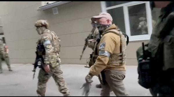 Founder of Wagner private mercenary group Yevgeny Prigozhin and Russian Wagner Group fighters.