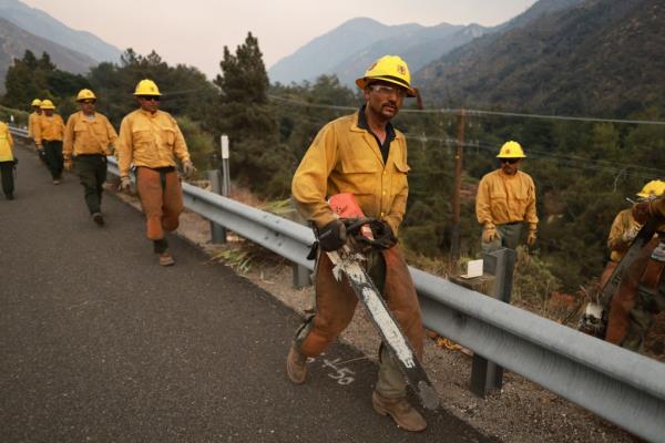 Three firefighters have been injured since the blaze was reported Thursday, state fire managers said.