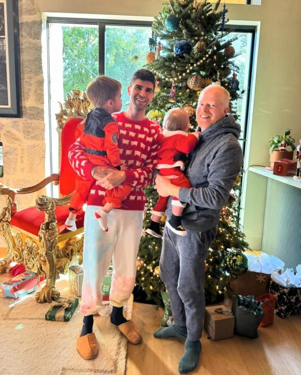 Justin Mikita and Jesse Tyler Ferguson with their sons