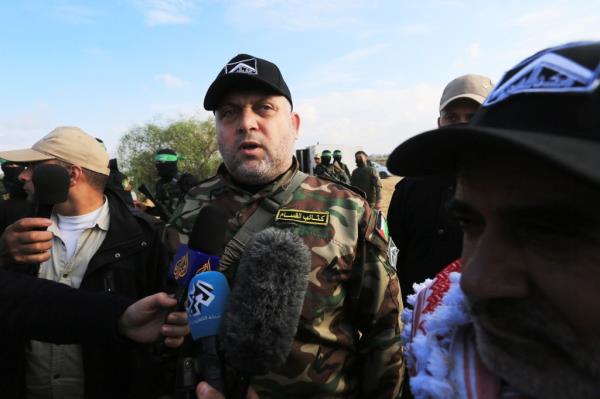 Ayman Nofal, a leader in the Izz al-Din al-Qassam Brigades, the military wing of Hamas speaks during Palestinian factions hold a joint military exercise in Rafah in the southern of Gaza strip, on December 29, 2021.