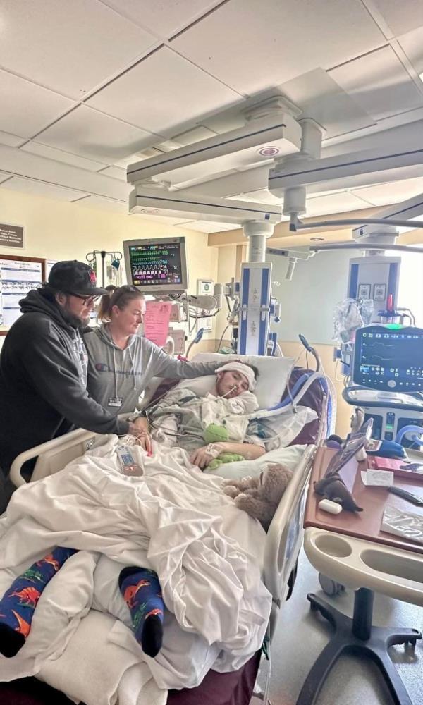John Procter VI in a hospital bed 
