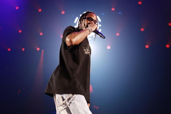 Travis Scott almost knocked off stage by giant floating head during NYC concert