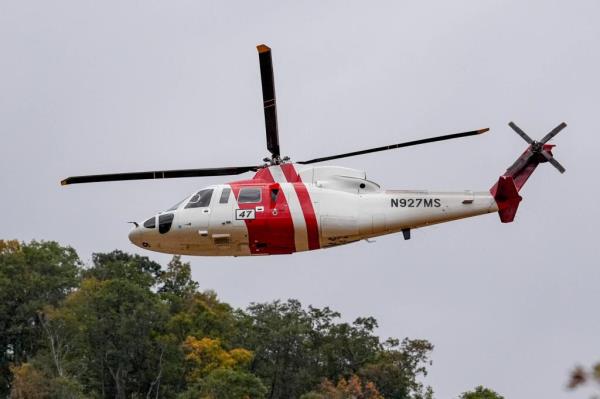 First respo<em></em>nders in a helicopter flying overhead in the aftermath of flooding caused by Hurricane Helene in Pensacola, North Carolina, October 4, 2024.