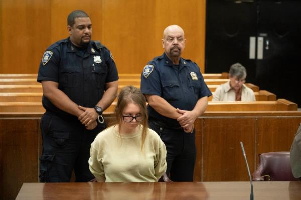 Anna Delvey in handcuffs