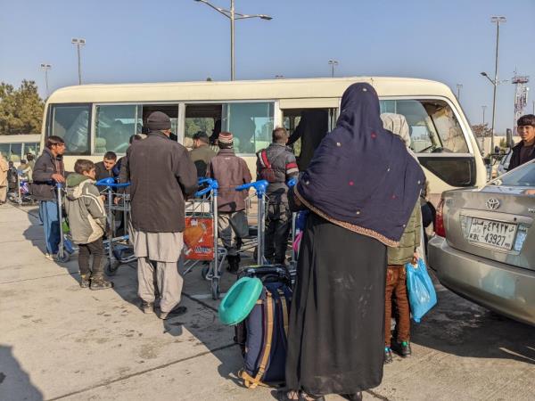 A group of people board a bus as they hope to flee as the US withdrew from Afghanistan.